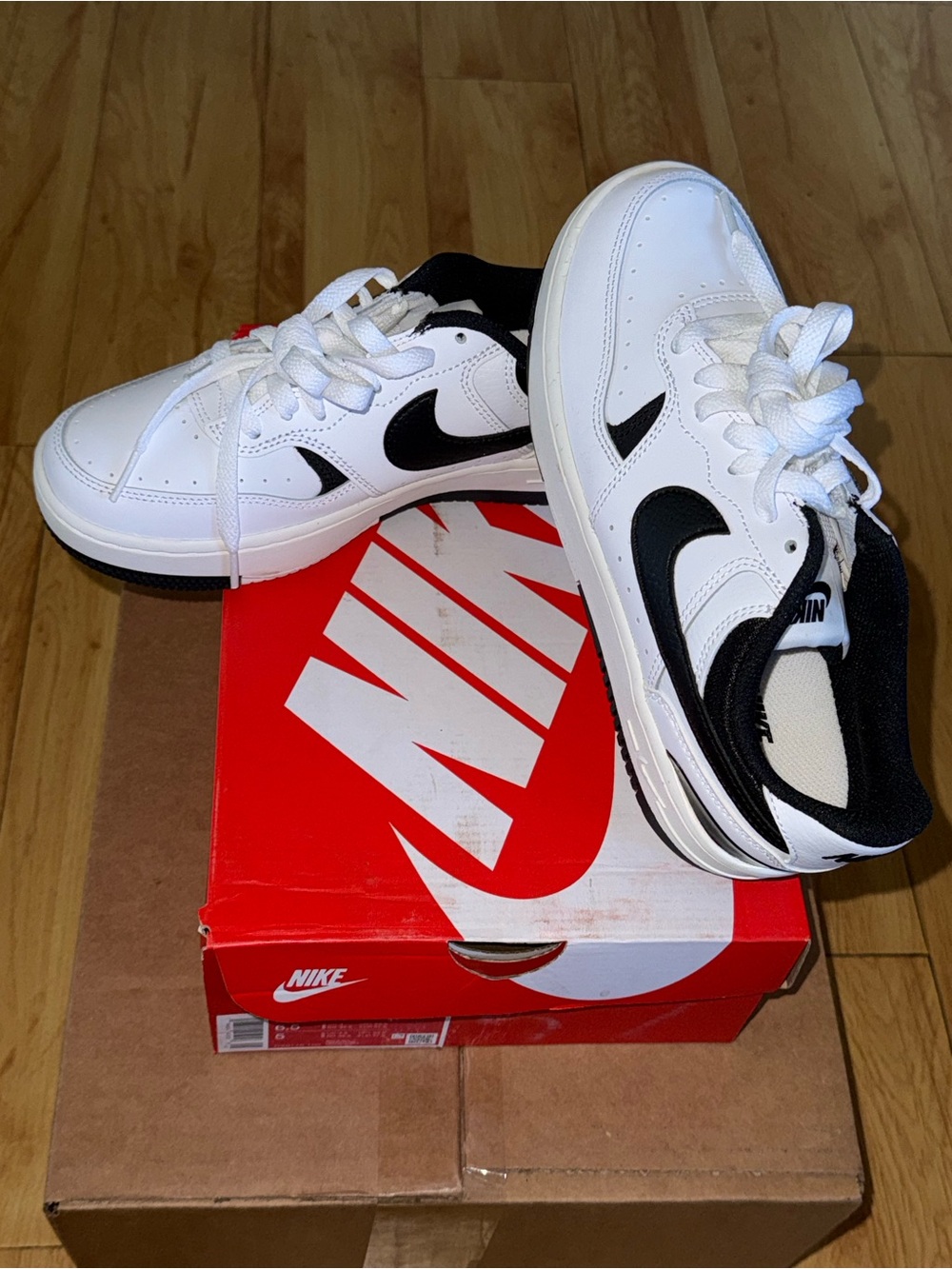 Nike White and Black Swoosh Low-Top Sneakers